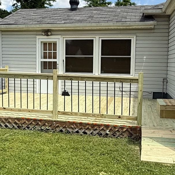 Newly built backyard deck with railing on a Louisville home