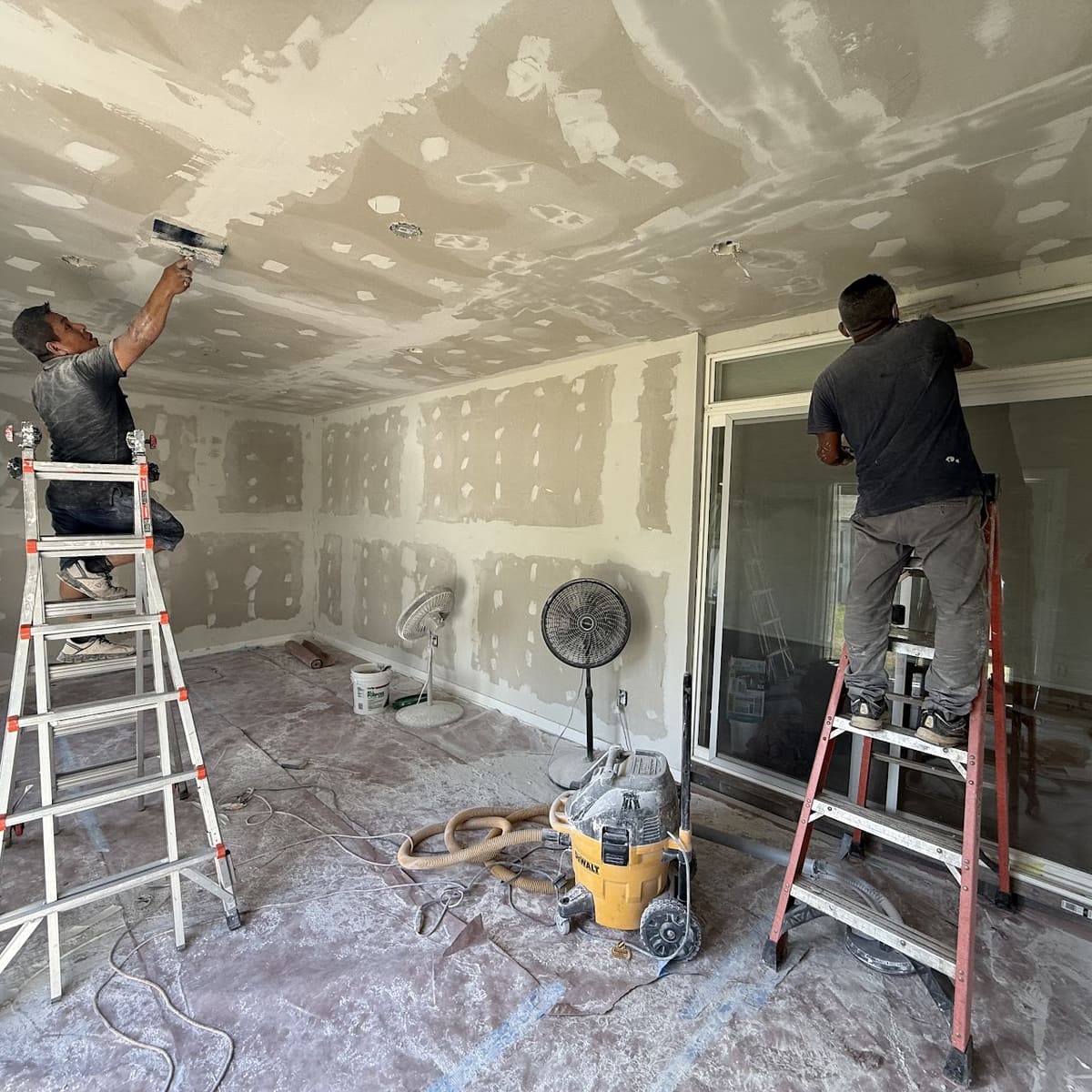 Drywall finishing and surface prep before painting